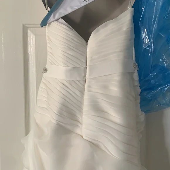 Beautiful off white Demtria cascading wedding dress.  Size 10, but altered. - Picture 11 of 12